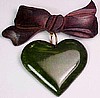 BP176 wood bow/ green bakelite heart pin